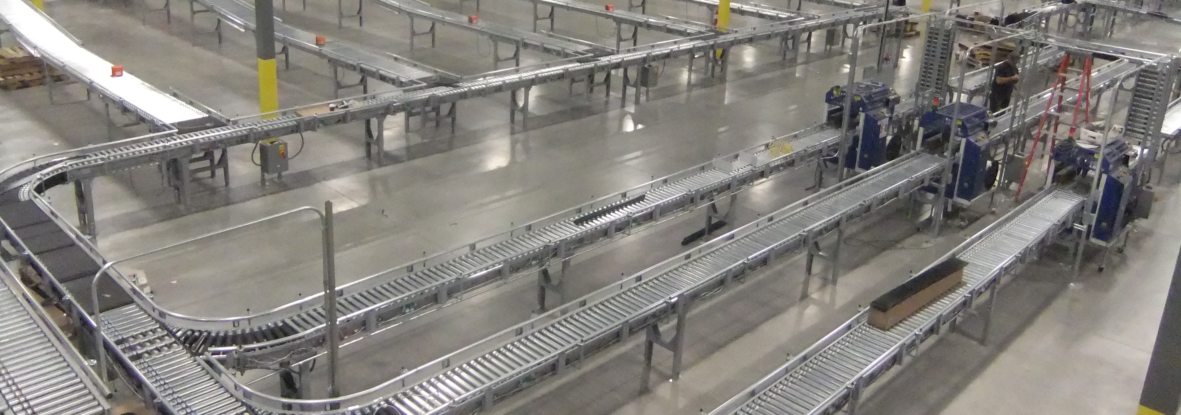 Conveyor feeding warehouse workflow